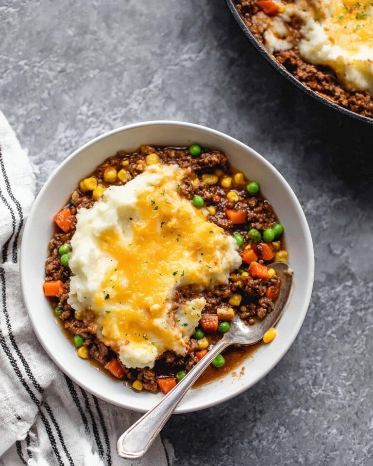 Hearty Cottage Pie with Beef, Sausage, and Cheesy Mashed Potatoes Recipe