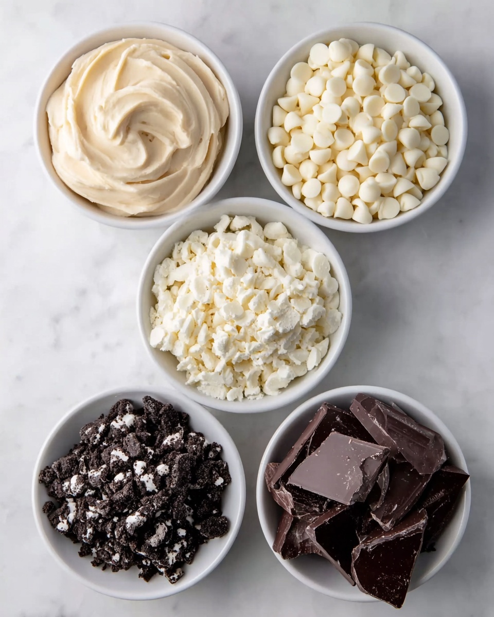 Five small white bowls are placed on a white marbled surface. The top left bowl holds smooth, creamy light beige frosting swirled into a peak. The top right bowl is filled with many shiny white chocolate chips, piled high. The bottom left bowl contains crushed white pieces with a crumbly texture. The center left bowl has dark crushed cookies with small white bits scattered through. The bottom right bowl shows large, broken pieces of dark chocolate with rough edges. photo taken with an iphone --ar 4:5 --v 7