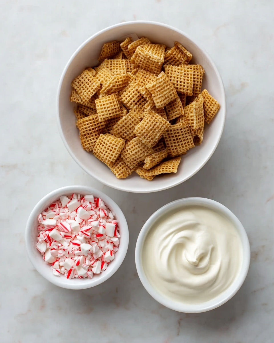 The image shows three white bowls on a white marbled surface. The largest bowl at the top is filled with square-shaped, golden-brown cereal pieces with a waffle-like texture. Below it to the left is a smaller bowl filled with white and red crushed peppermint candy pieces. To the right of the peppermint bowl is another small white bowl containing smooth, creamy white yogurt with soft swirls on top. The arrangement is simple and clean, with the bowls neatly spaced apart. photo taken with an iphone --ar 4:5 --v 7
