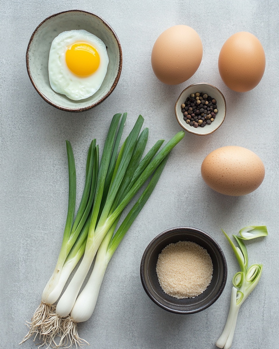 A white bowl filled with light brown, clear broth layered with delicate yellow egg ribbons floating throughout, topped with small pieces of bright green chopped scallions. The bowl is placed on a white cloth with a black embroidered pattern and next to a white ceramic soup spoon. A couple of green scallions rest diagonally by the bowl on a white marbled surface. The texture of the soup looks smooth and lightly thickened. Photo taken with an iphone --ar 4:5 --v 7