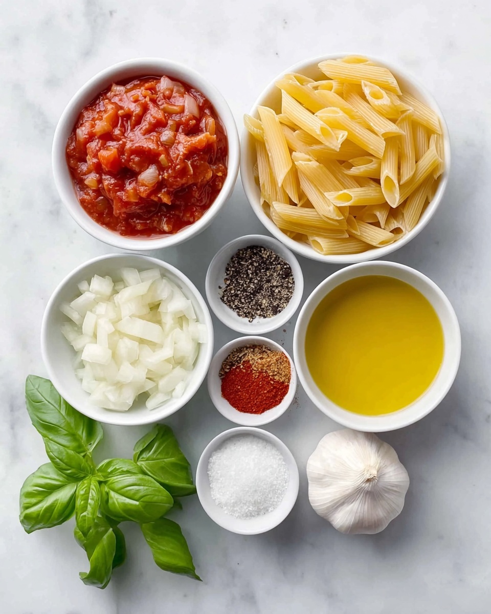 The image shows several small white bowls and loose ingredients arranged on a white marbled surface. At the top left, there is a bowl filled with chunky red tomato sauce. Next to it on the right is a pile of uncooked pale yellow penne pasta. Below the tomato sauce, there is a bowl with small white chopped onions. To the right of the onions, a bowl holds golden yellow olive oil, and next to that is another bowl with black pepper and red chili powder, divided inside. Below these spices, a small bowl contains coarse white salt. Two whole garlic bulbs rest near the bowls, one on the left bottom corner and one at the bottom right. A fresh cluster of bright green basil leaves is positioned near the bottom left. All the items are spaced evenly and placed neatly on the white marbled background. Photo taken with an iphone --ar 4:5 --v 7
