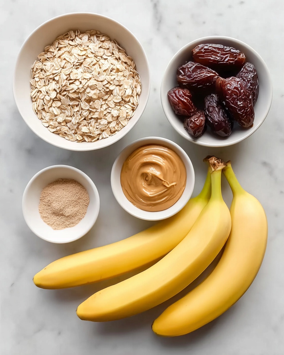 On a white marbled surface, there are five white bowls and two yellow bananas arranged neatly. The largest bowl is filled with light beige rolled oats with a rough texture, positioned at the top left. To the right of it is a smaller bowl filled with dark brown dates that have a shiny, wrinkled texture. Below the oats bowl is another white bowl containing smooth, light brown peanut butter with a creamy texture and a visible swirl pattern on the top. Next to the peanut butter, there is a small white bowl that holds two powders side by side: a light brown powder on the left and a white powder on the right, both with fine textures. The two ripe yellow bananas lie diagonally across the bottom right of the image, with their smooth skins showing some details near the stems. Photo taken with an iphone --ar 4:5 --v 7