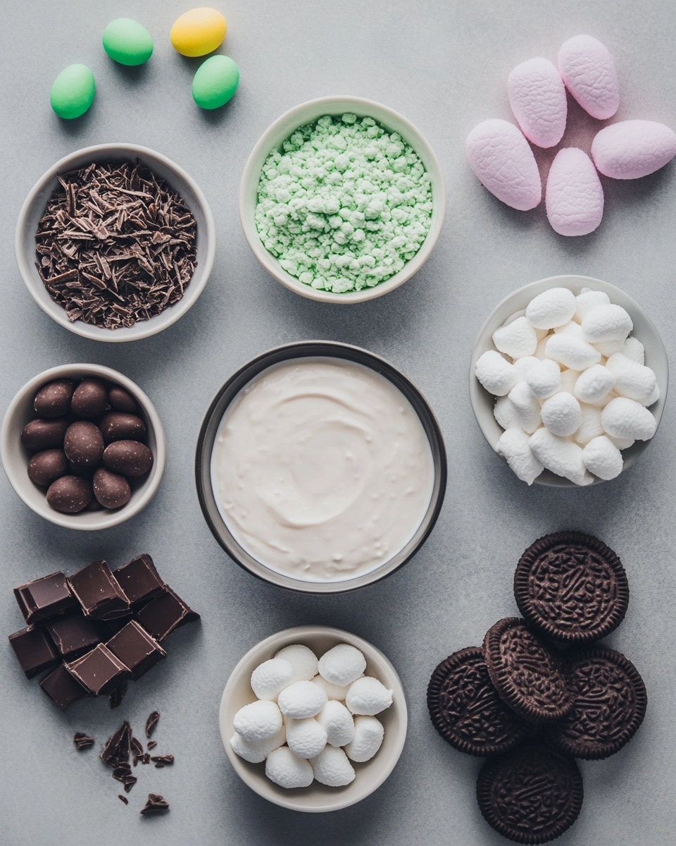 This dessert is a clear glass cup with four visible layers, starting with a bottom dark brown cake layer, followed by a light brown creamy layer, another dark brown cake layer, and topped with a final light brown creamy layer. The top is covered with bright green shredded coconut that looks like grass. On top of the green coconut, there is a pink bunny-shaped candy in the center with small dark chocolate dots for eyes and nose. Around the bunny, there are two small candy eggs, one pale blue and one yellow, a small bright orange carrot candy with white dots, and a small blue flower candy. The glass cup sits on a white plate with small purple and pink flower candies and an orange carrot candy on the side. The whole setup is on a white marbled texture surface with a soft blue checkered cloth nearby. Photo taken with an iphone --ar 4:5 --v 7