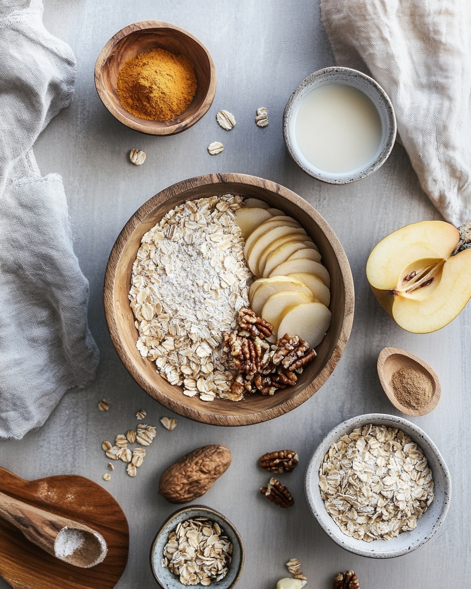 The image shows a close-up of a single rectangular oat bar held above a group of similar bars. The oat bar has a rough, crumbly texture with visible layers of brown baked dough mixed with small apple pieces inside. The top layer is decorated with scattered pecan halves, rolled oats, and thin white icing drizzled in a crisscross pattern. The surrounding oat bars create a soft brown background with similar toppings, all placed on a white marbled surface. photo taken with an iphone --ar 4:5 --v 7