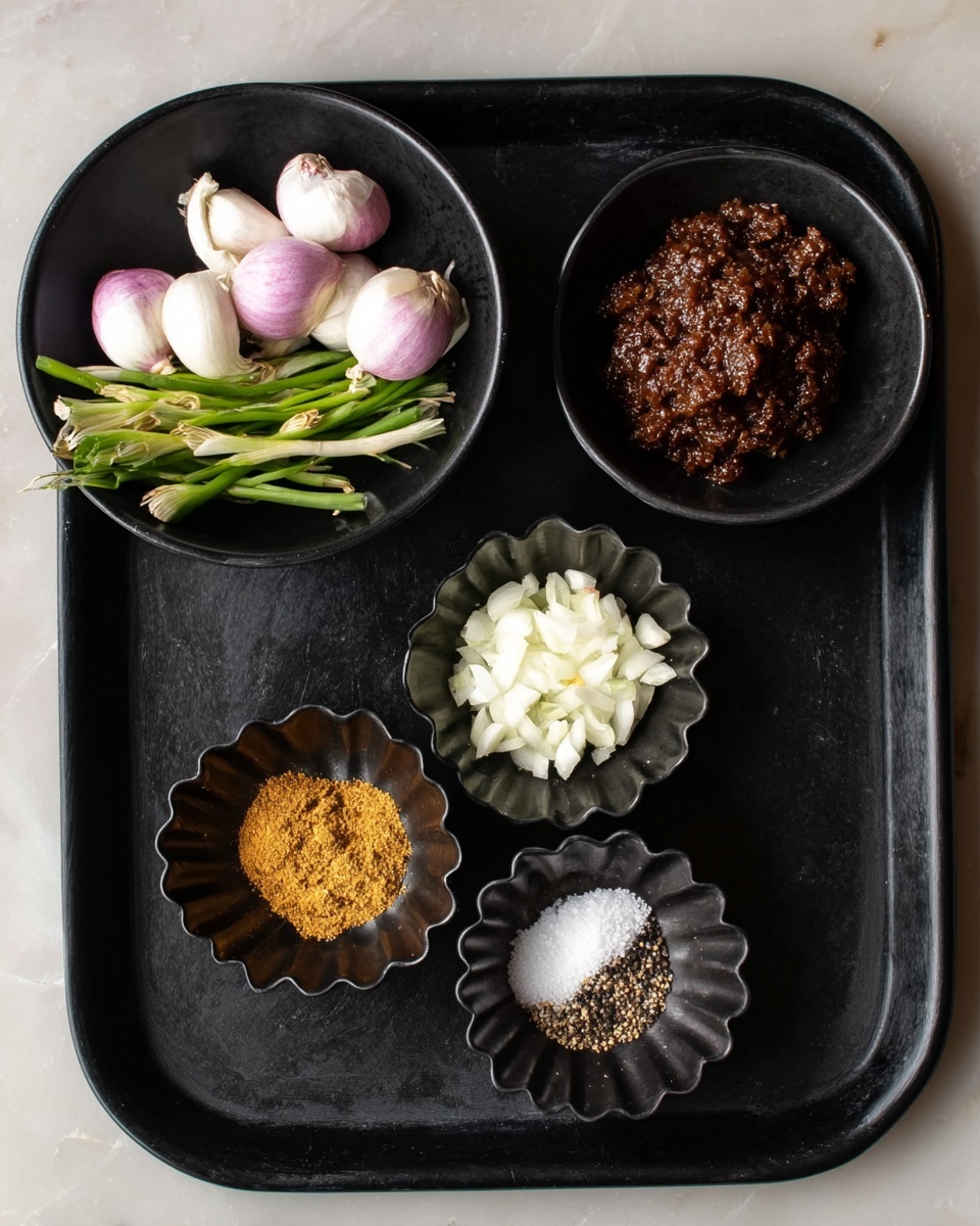 A black tray holds six small black bowls arranged in a rough circle. The largest bowl on the top right contains dark brown textured paste. To its top left is a medium bowl filled with whole small green onions and white shallots with light purple tips. Below that is a smaller bowl of finely chopped white garlic. To the bottom left, a scalloped bowl holds a mound of golden yellow powdered spice. Next to it is another small scalloped bowl with coarse white salt, and to its right is a similar bowl with ground black pepper. The background is a white marbled texture. Photo taken with an iphone --ar 4:5 --v 7