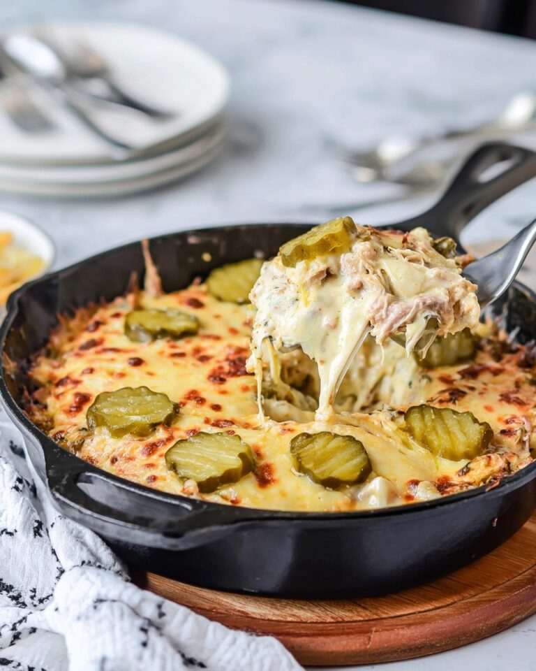 Cuban Casserole with Pulled Pork, Ham, Swiss Cheese, and Dill Pickles Recipe