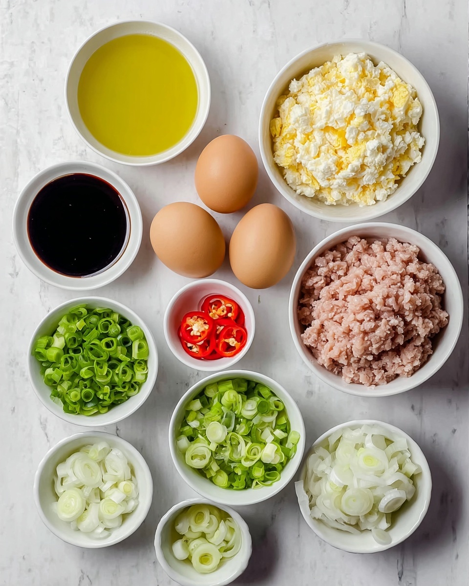 The image shows a top view of several white bowls and two brown eggs arranged on a white marbled surface. There is one large bowl filled with light pink ground meat on the right bottom, and next to it a medium bowl with finely chopped white and yellow boiled eggs. Above these are two whole brown eggs placed side by side. To the left of the eggs are two small bowls filled with dark soy sauce. Below these soy sauce bowls, there is a small bowl with bright red sliced chili peppers, and next to it a bowl with chopped white onions. Below the small bowls are two medium bowls, one containing light green chopped leeks and the other with a lighter green finely chopped vegetable, possibly scallions. At the top left is a medium bowl filled with golden yellow oil. The overall presentation is neat, and all the bowls are on the white marbled surface. Photo taken with an iphone --ar 4:5 --v 7