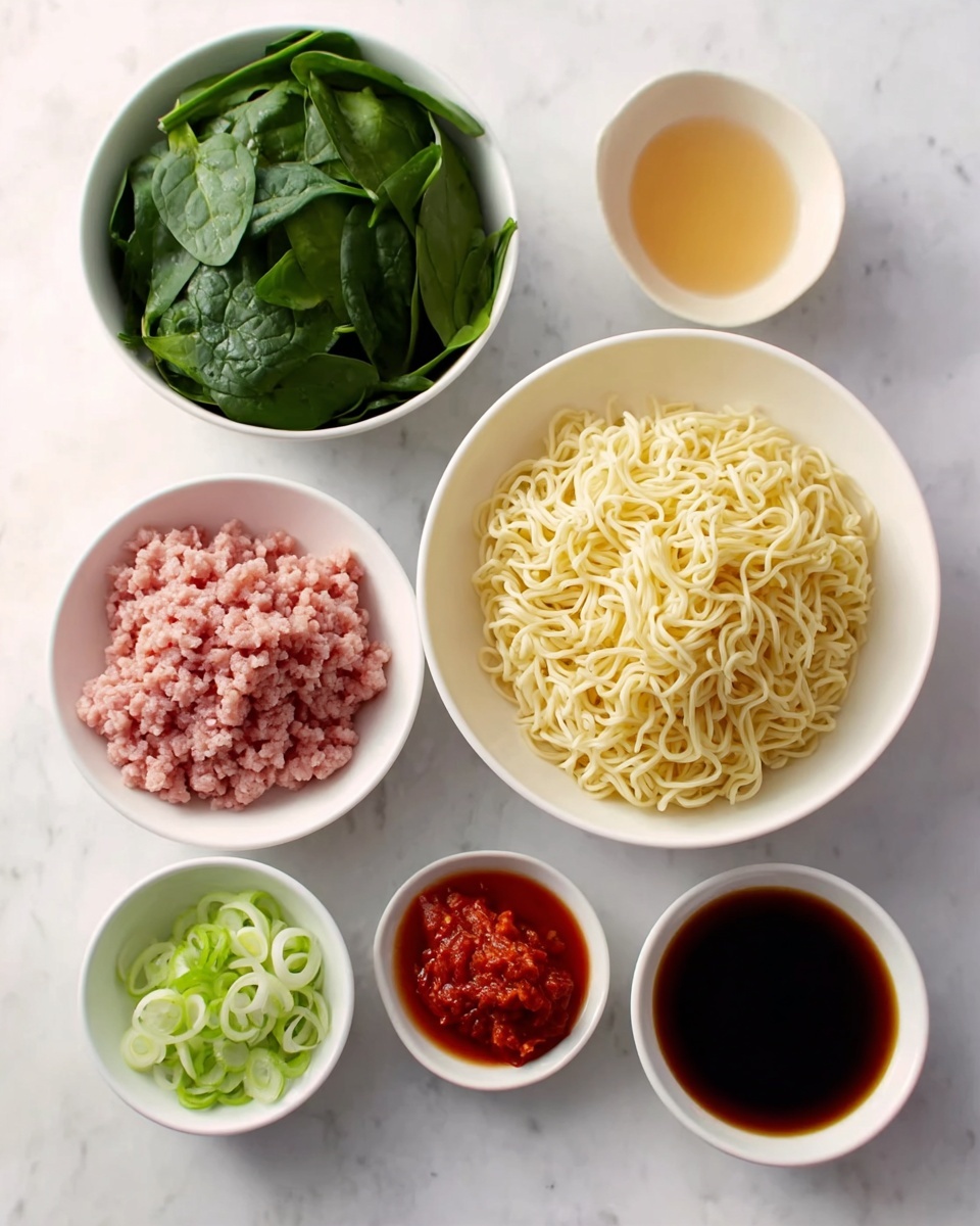A white bowl filled with ramen noodles in brown broth is shown from above. The dish has four main sections: at the top left, dark green cooked leafy vegetables; at the bottom left, brown seasoned ground meat topped with sliced green onions; on the right, pale yellow thick noodles; and in the center, bright red shredded pickled ginger. A white ceramic spoon rests on the right side inside the bowl, with dark brown wooden chopsticks placed across the top edge. The bowl sits on a white marbled surface. Photo taken with an iphone --ar 4:5 --v 7