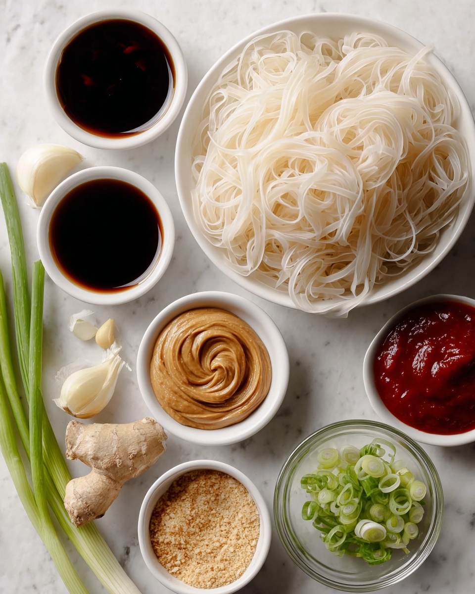 The image shows a black pan filled with long, thin noodles coated in a shiny light brown sauce. The noodles are mixed with small pieces of chopped green onions and white nuts scattered throughout. A wooden spatula is lifting some noodles on the left side, showing the texture and glossiness of the sauce. The pan rests on a white marbled surface. photo taken with an iphone --ar 4:5 --v 7