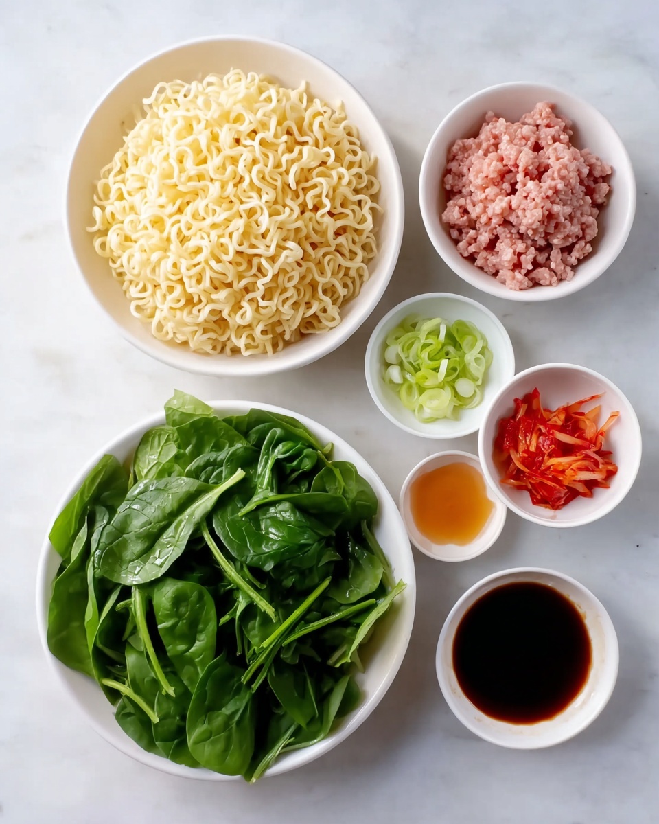A white bowl filled with four main layers sitting in a light brown broth; the first layer shows yellow wavy noodles on the right side, next to a small pile of bright red thin strips in the center, with chopped green onions just below the red strips, and ground brown meat mixed with green bits on the left side, while dark green leafy vegetables fill the upper left corner. A white soup spoon rests inside the bowl on the right, with dark brown wooden chopsticks placed over the edge of the bowl. The bowl sits on a white marbled surface. Photo taken with an iphone --ar 4:5 --v 7