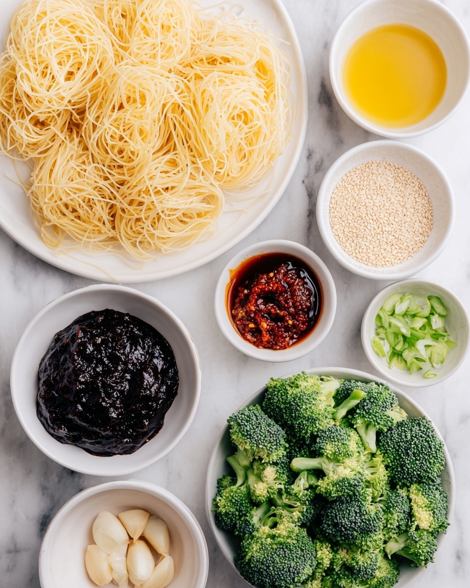 A round white plate holds a serving of dark brown noodles as the base layer, with a smooth and slightly shiny texture. On top, bright green broccoli florets are scattered evenly, showing a fresh, slightly rough surface. Thin slices of light green spring onions are placed over both the broccoli and noodles, adding small pops of color and a crisp texture. White sesame seeds are sprinkled across the entire dish, giving small points of contrast. On the right edge of the plate, a pair of long, slender wooden chopsticks rests, leaning diagonally on the noodles. The plate sits on a clean, white marbled surface. photo taken with an iphone --ar 4:5 --v 7